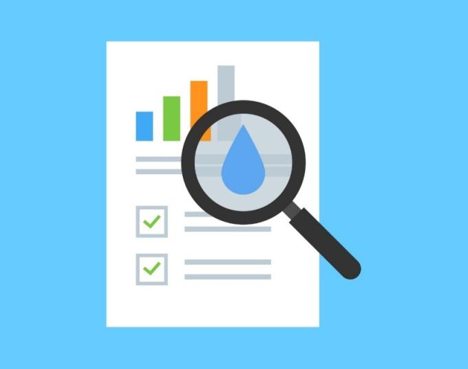 An illustrated magnifying glass hovers over an illustration of a report with graphs to zoom in on a water droplet.