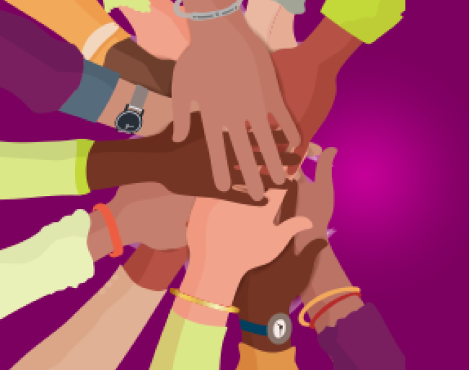 People in a circle with one arm in so their hands are stacked on top of each other.