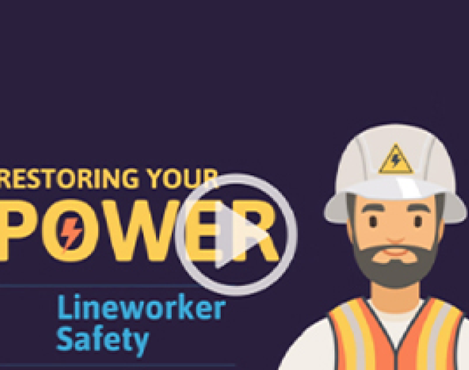 Cartoon image of man with a mustache and beard wearing a white hardhat that has a yellow triangle symbol on the front of it containing a lightning bolt. He is also wearing an orange safety vest with yellow stripes going down from the top to the bottom on both sides. Yellow text says “Restoring your power,” and light blue text says, “Lineworker safety.” This is an image that shows before the video plays.